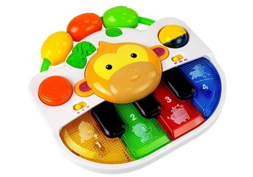 A piano with a monkey for a baby. Sound and light