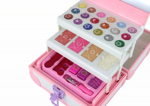 Set of beauty cosmetics for make-up doing nails in a pink case