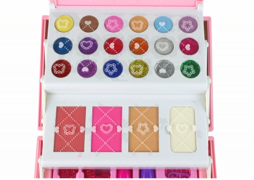 Set of beauty cosmetics for make-up doing nails in a pink case