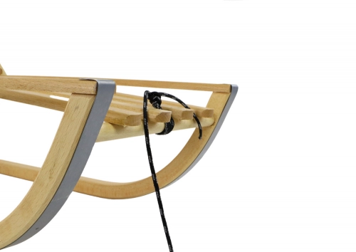 Wooden sled with a backrest and a string of sleds